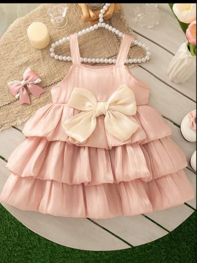 Girls Pink Layered Tulle Dress with Large Bow Detail and Sleeveless Design